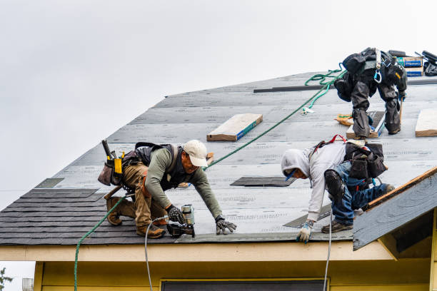 Professional Roofing technician working in Mentone, CA